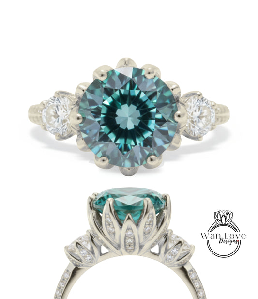 A silver engagement ring with a large blue gemstone, surrounded by smaller diamonds.