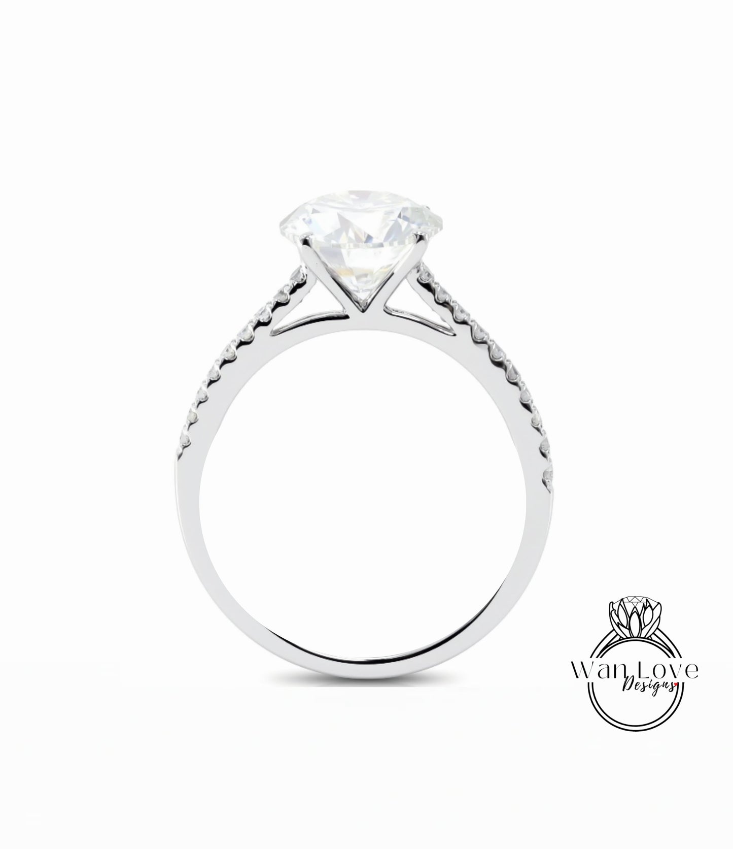 A silver engagement ring with a large diamond set in the center, surrounded by smaller diamonds along the band.