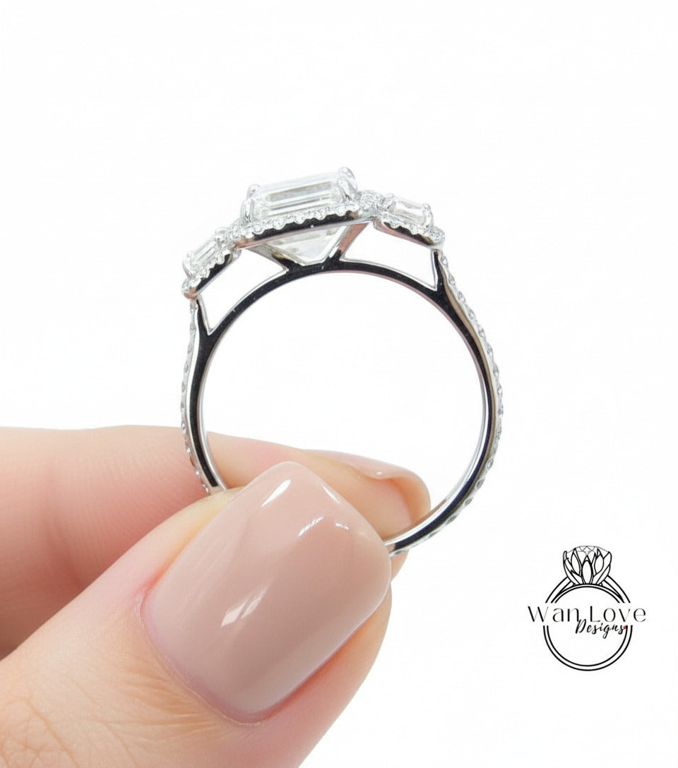 a close up of a person holding a ring