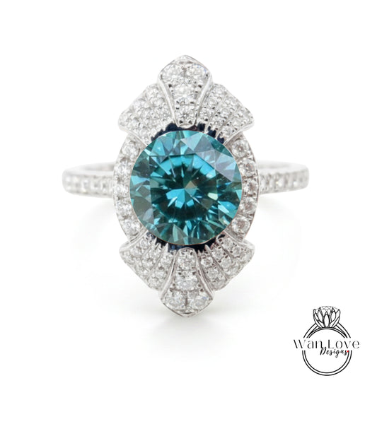 A stunning blue gemstone ring with a large central diamond surrounded by smaller diamonds, set in a silver band.