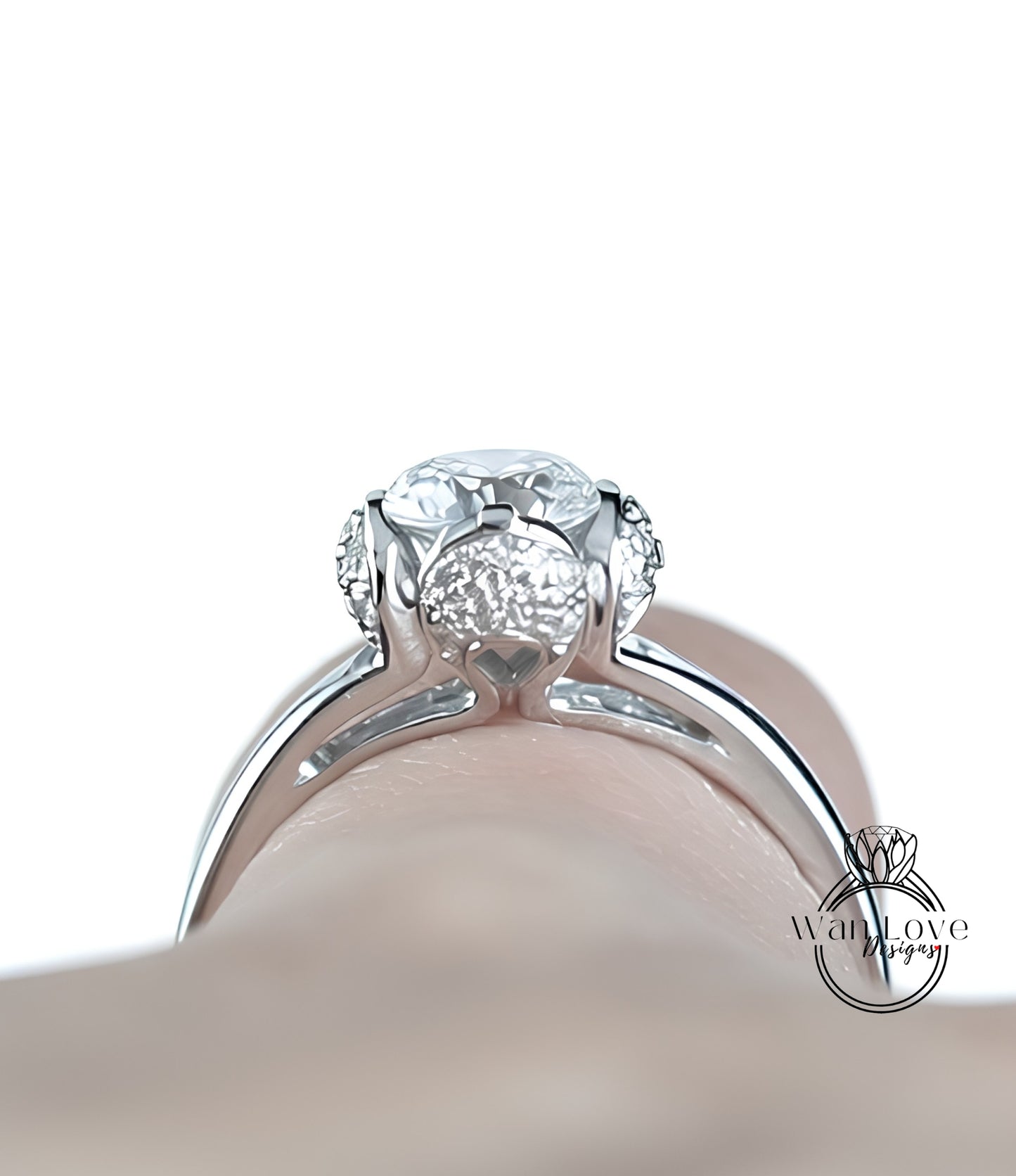 A close-up view of a diamond engagement ring on a person's finger.