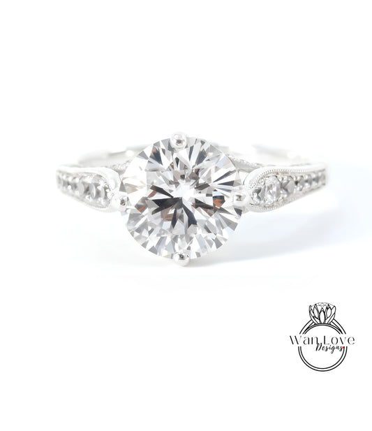 A close-up view of a diamond engagement ring with a large, brilliant-cut diamond set in a silver band.