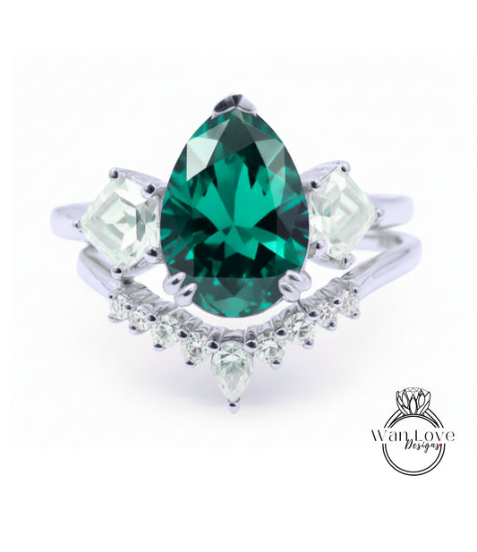 A silver ring with a large, green gemstone at the center, surrounded by smaller diamonds.