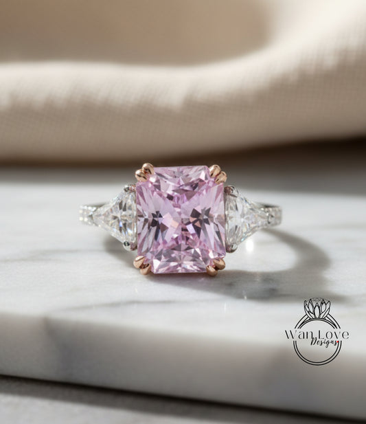 A large pink gemstone ring with a diamond-encrusted band, placed on a marble surface.
