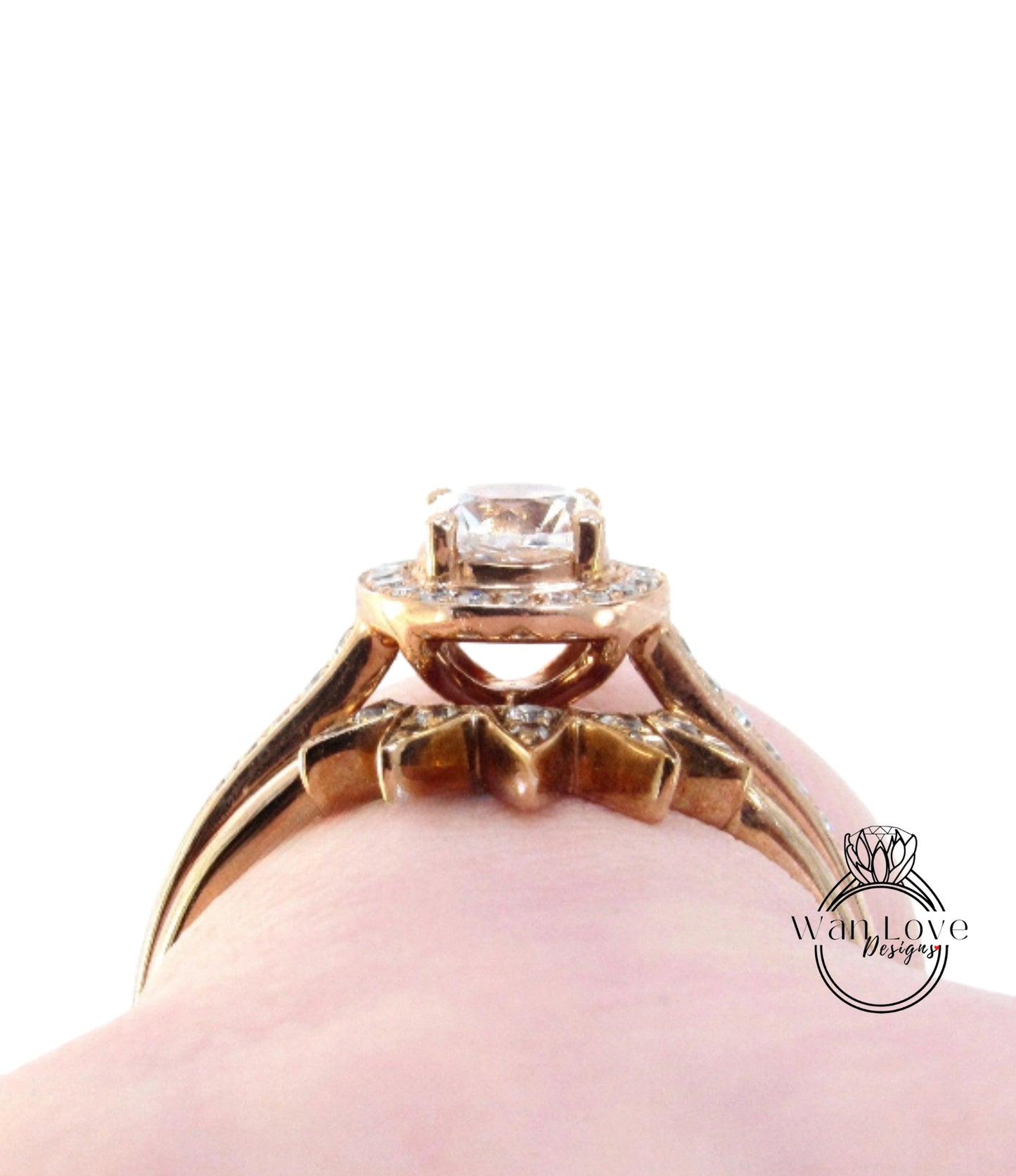 A close-up view of a gold ring with a large central gemstone, showcasing the intricate design and craftsmanship of the piece.