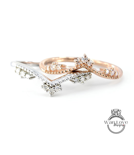 two rings with diamond accents, one in silver and one in gold, showcasing their intricate designs and sparkling gemstones.