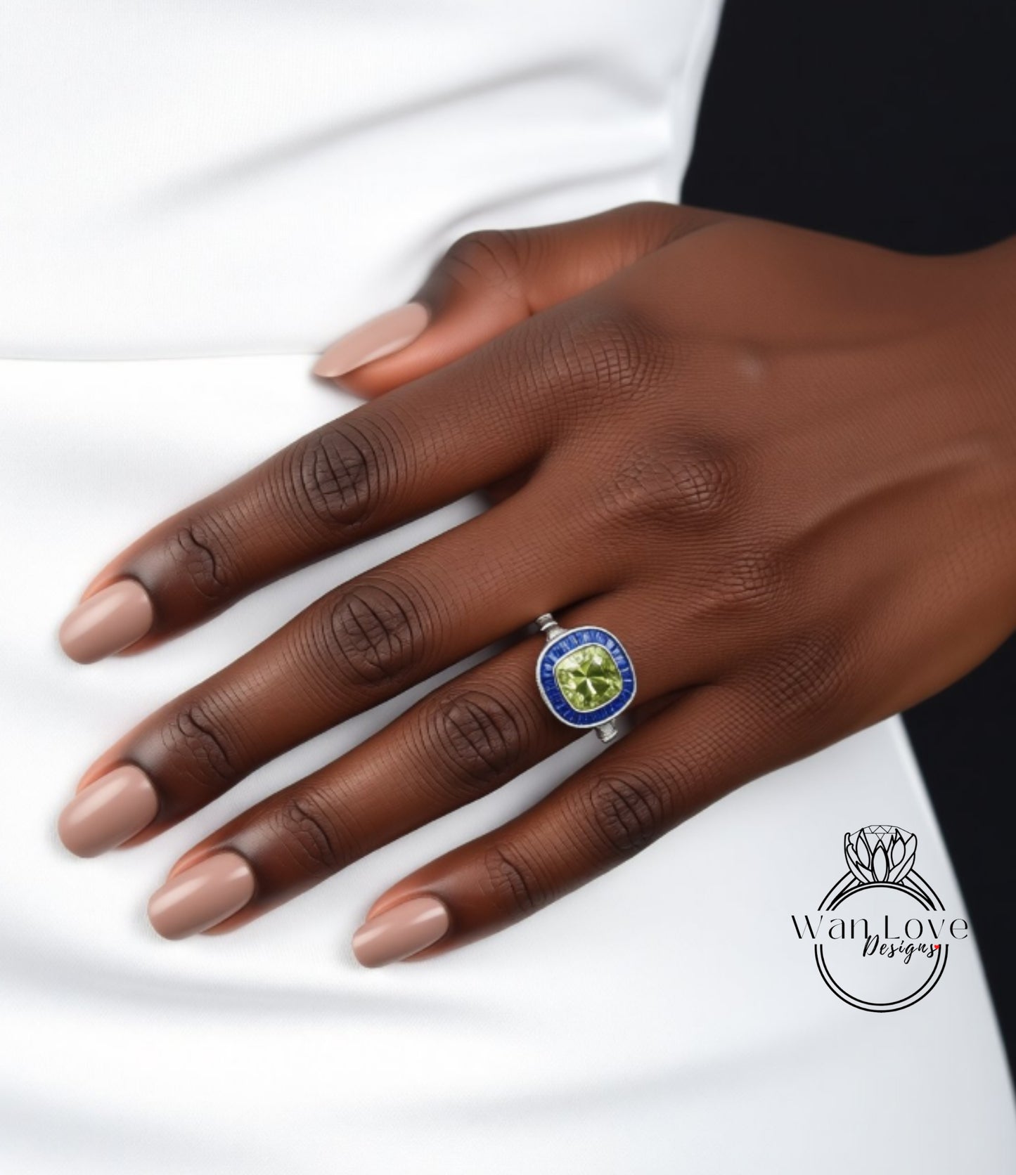 A close-up of a hand wearing a ring with a blue and green gemstone.