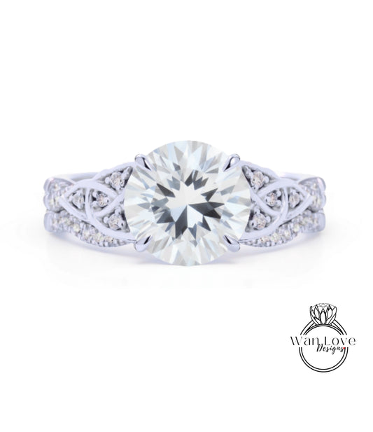 A close-up of a diamond engagement ring with a large, brilliant-cut diamond set in a silver band adorned with smaller diamonds.