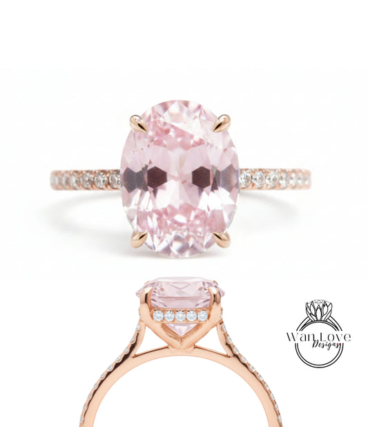 A beautiful pink gemstone engagement ring with a gold band and small diamonds.