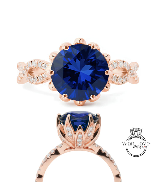 a beautiful blue gemstone ring with a rose gold band and a large blue gemstone at the center.