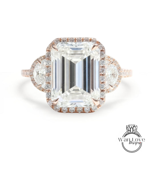 A large, rectangular diamond engagement ring with a halo of smaller diamonds around the center stone.