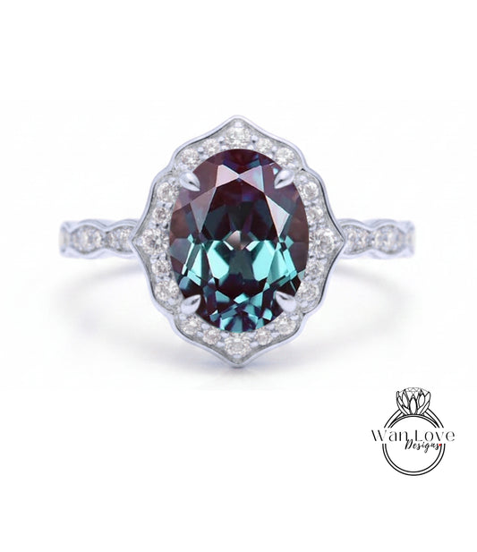 A stunning ring featuring a large oval-shaped gemstone surrounded by a halo of smaller diamonds, set in a silver band.