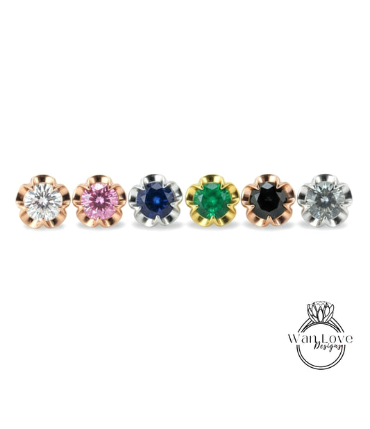 a row of six different colored gemstone earrings, each with a unique flower-shaped design.