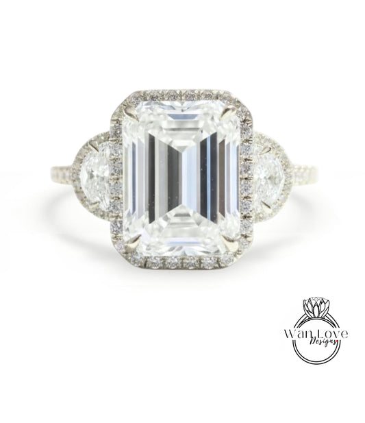 A large, rectangular diamond engagement ring with a halo of smaller diamonds around the center stone.
