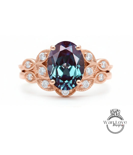 a beautiful ring with a large oval-shaped gemstone set in a rose gold band, surrounded by smaller diamonds.