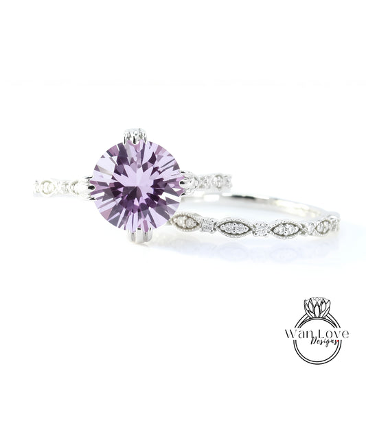 A close-up image of a beautiful purple gemstone ring with a delicate band adorned with small diamonds.