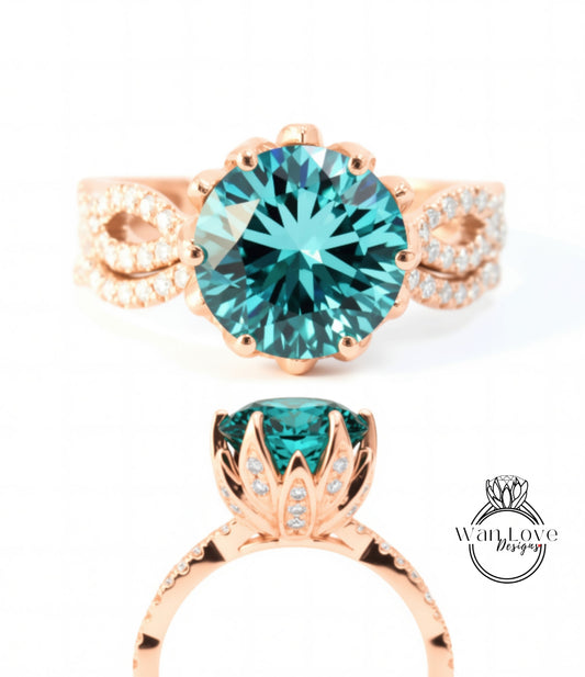a beautiful rose gold ring with a large blue gemstone set in the center. The ring has a delicate floral design around the gemstone, and the gemstone itself is quite large and blue in color.