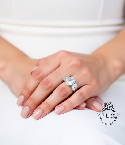 A close-up of a person's hands wearing a large, sparkling diamond ring.