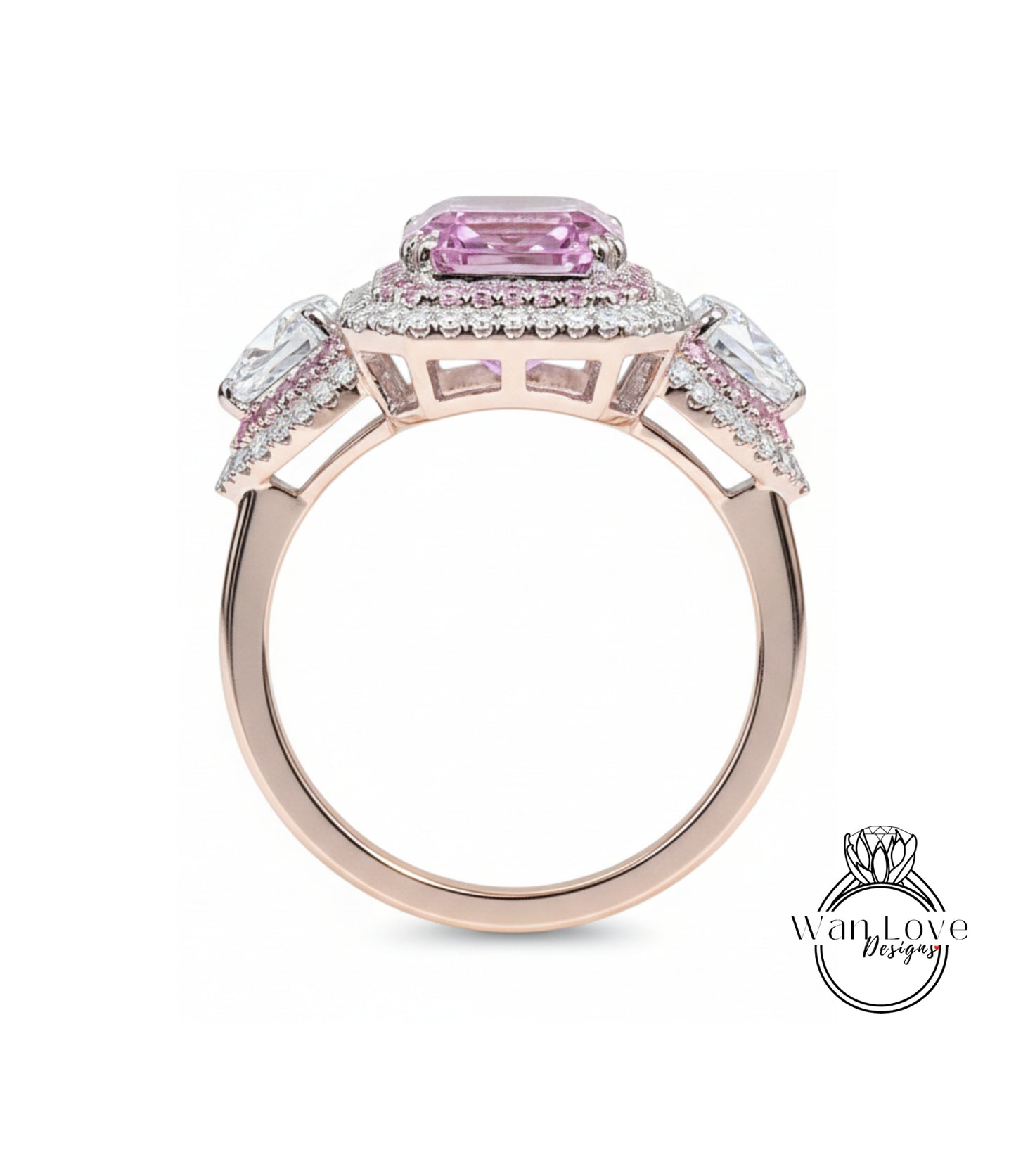 A beautiful pink gemstone ring with a halo of smaller diamonds around the center stone.