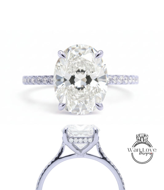 A close-up view of a diamond engagement ring with a large oval-shaped diamond set in a solitaire ring band.