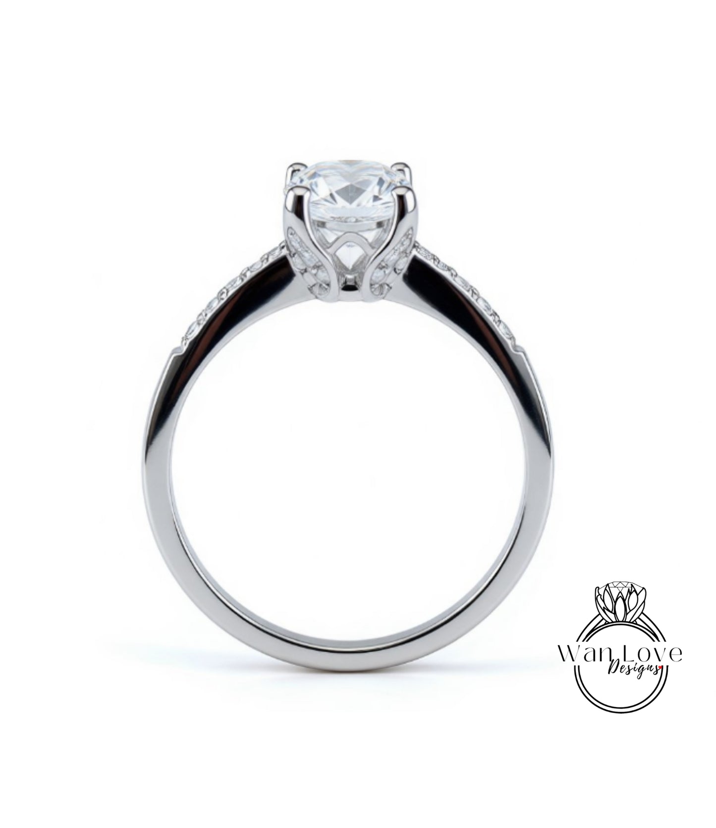 A silver engagement ring with a large central diamond and a smaller diamond accent on the band.
