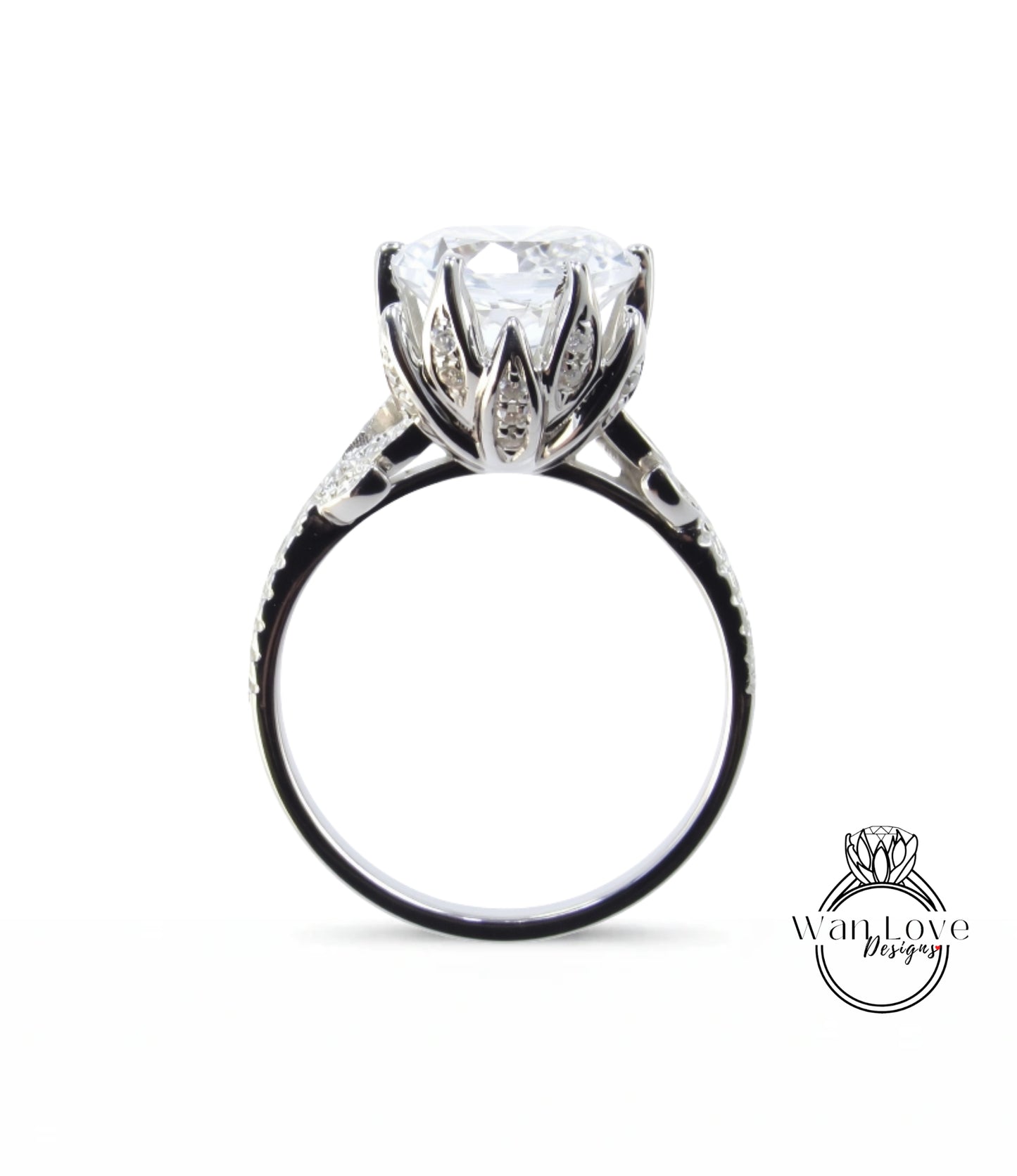 A close-up view of a silver ring with a large, clear gemstone set in the center.