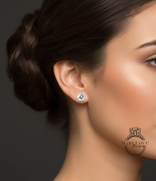 A close-up of a woman's face, focusing on her ear with a diamond earring.
