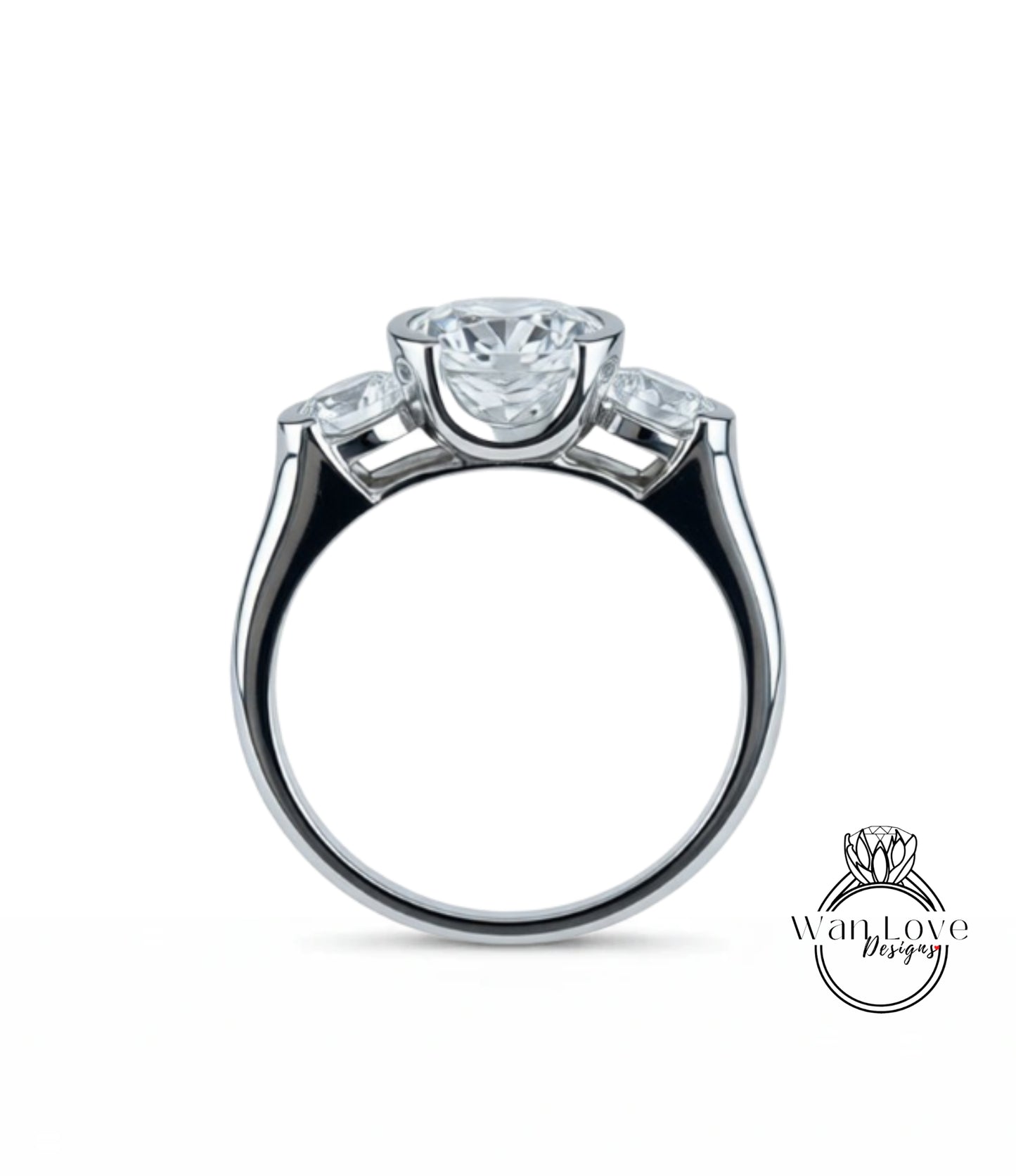 A silver ring with a large central diamond and three smaller diamonds on either side.