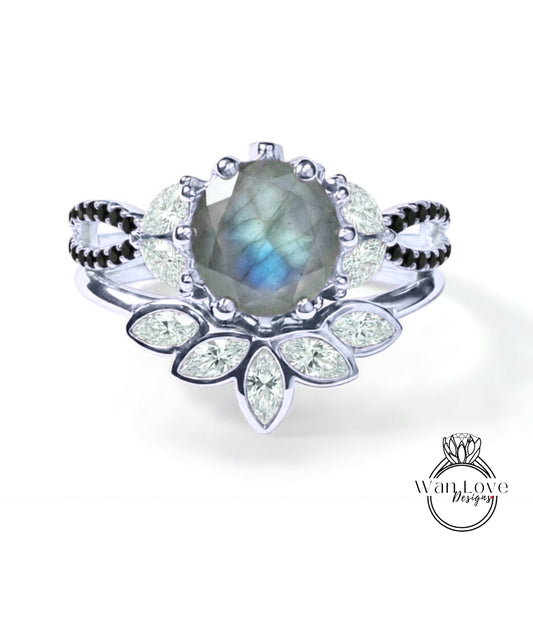 A silver ring with a large blue gemstone at the center, surrounded by smaller diamonds and a floral design.