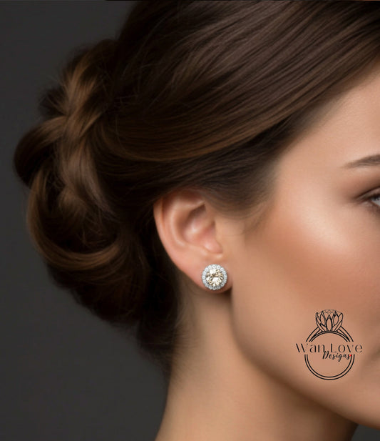 A close-up of a woman's face, focusing on her earrings and hair.