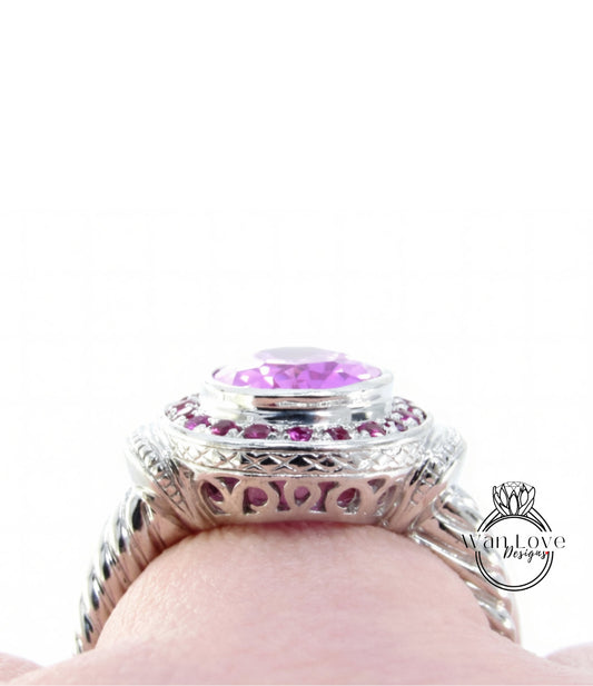 A close-up view of a silver ring with a large purple gemstone, showcasing the intricate design and craftsmanship.