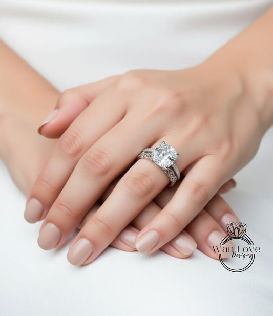 A close-up image of a person's hands wearing a large diamond engagement ring.