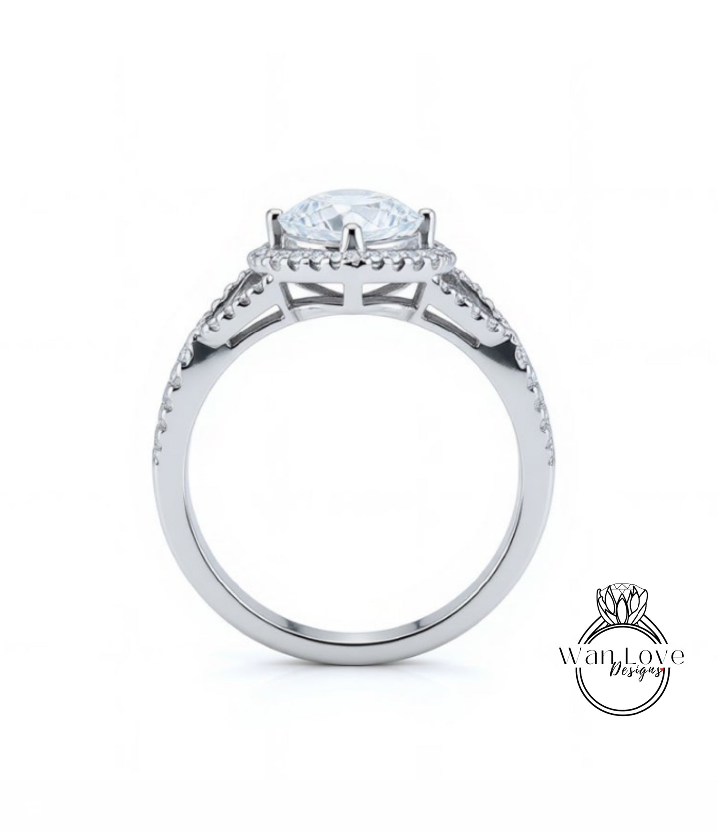 A silver engagement ring with a large central diamond and a halo of smaller diamonds around the center stone.