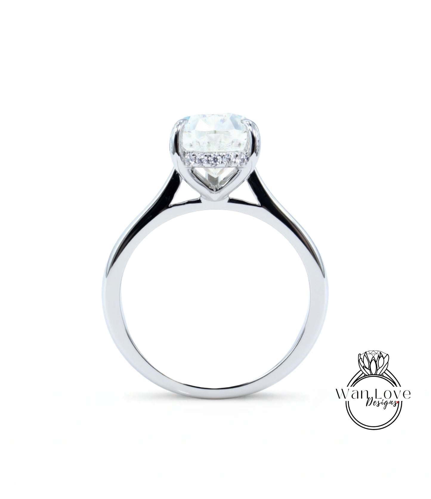 A silver engagement ring with a large diamond set in the center, showcasing the intricate design and craftsmanship of the jewelry piece.