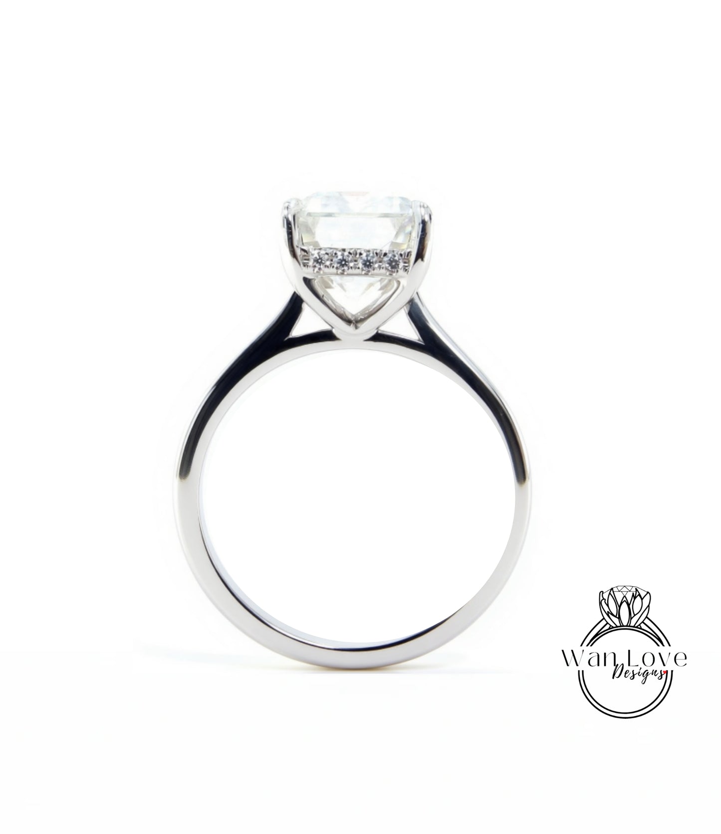 A silver engagement ring with a large, clear gemstone set in the center of the band.