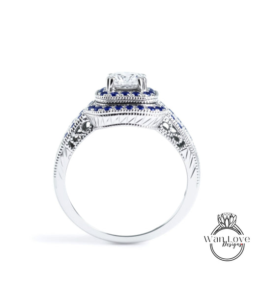 A silver ring with a large diamond at the center, surrounded by blue gemstones.
