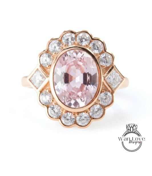 A gold ring with a large oval-shaped gemstone at the center, surrounded by smaller diamonds.