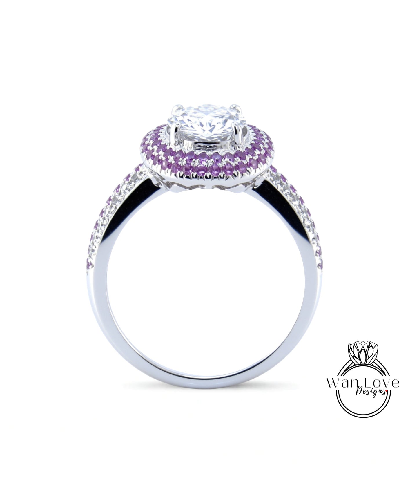 A silver ring with a large central diamond surrounded by a halo of smaller diamonds and purple gemstones.