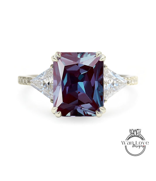 A large, purple gemstone ring with a diamond-encrusted band.