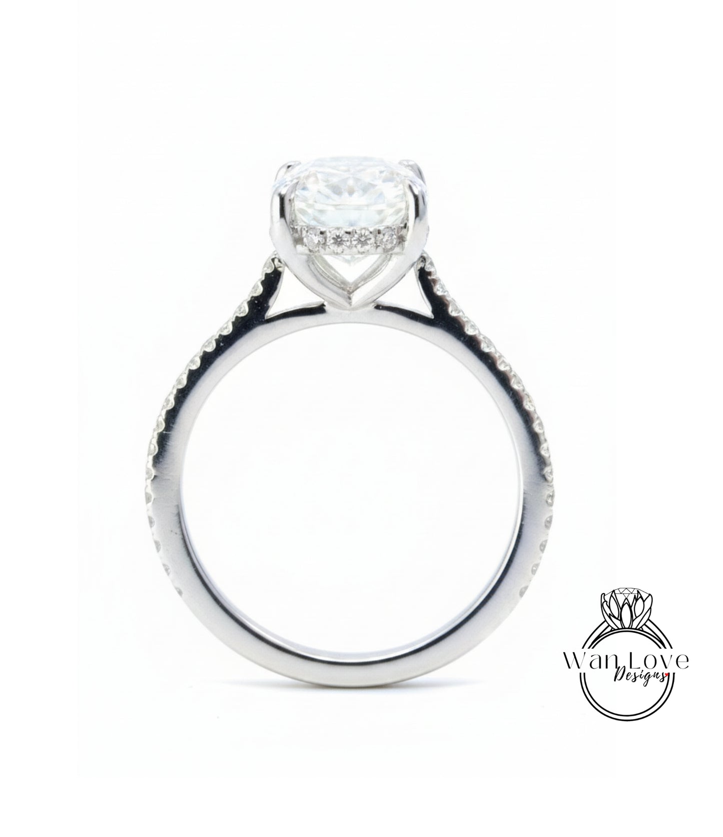 A silver engagement ring with a large central diamond and smaller diamonds around the band.