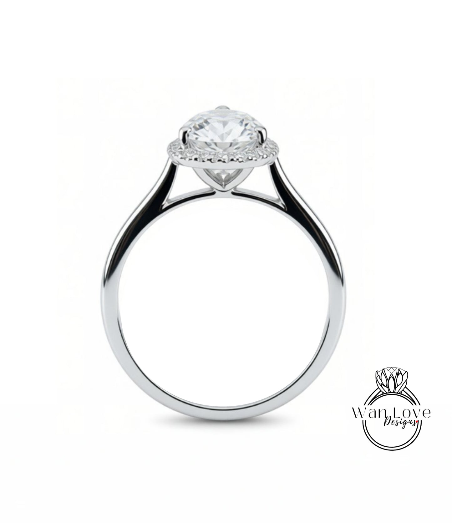 A close-up view of a silver engagement ring with a large, round diamond at the center, surrounded by a halo of smaller diamonds.
