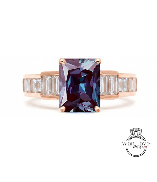 a ring with a large, dark purple gemstone set in a rose gold band.