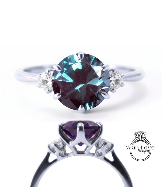 a silver ring with a large oval-shaped gemstone, likely a sapphire, surrounded by smaller diamonds.