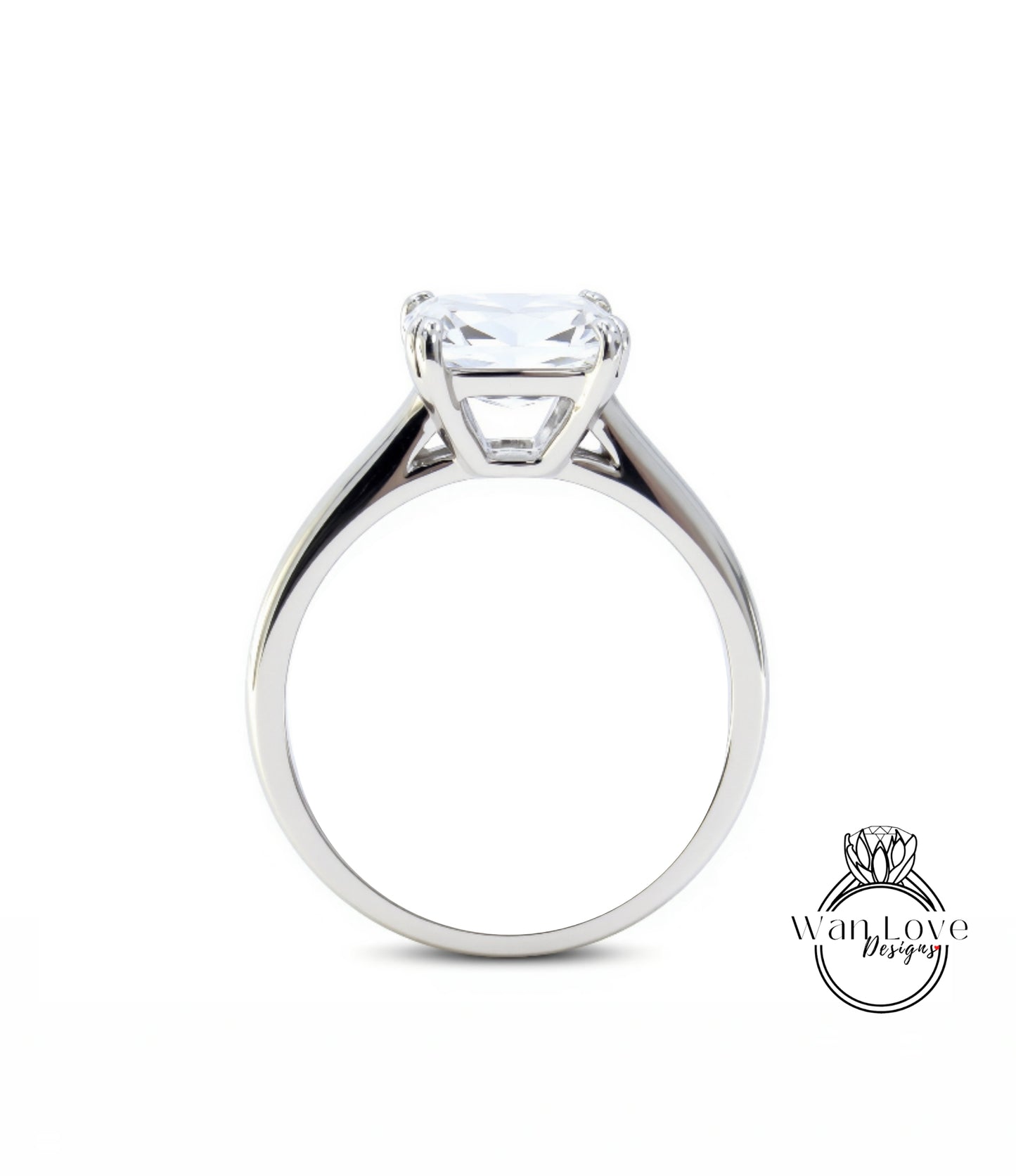 A silver engagement ring with a large, clear gemstone set in the center of the band.