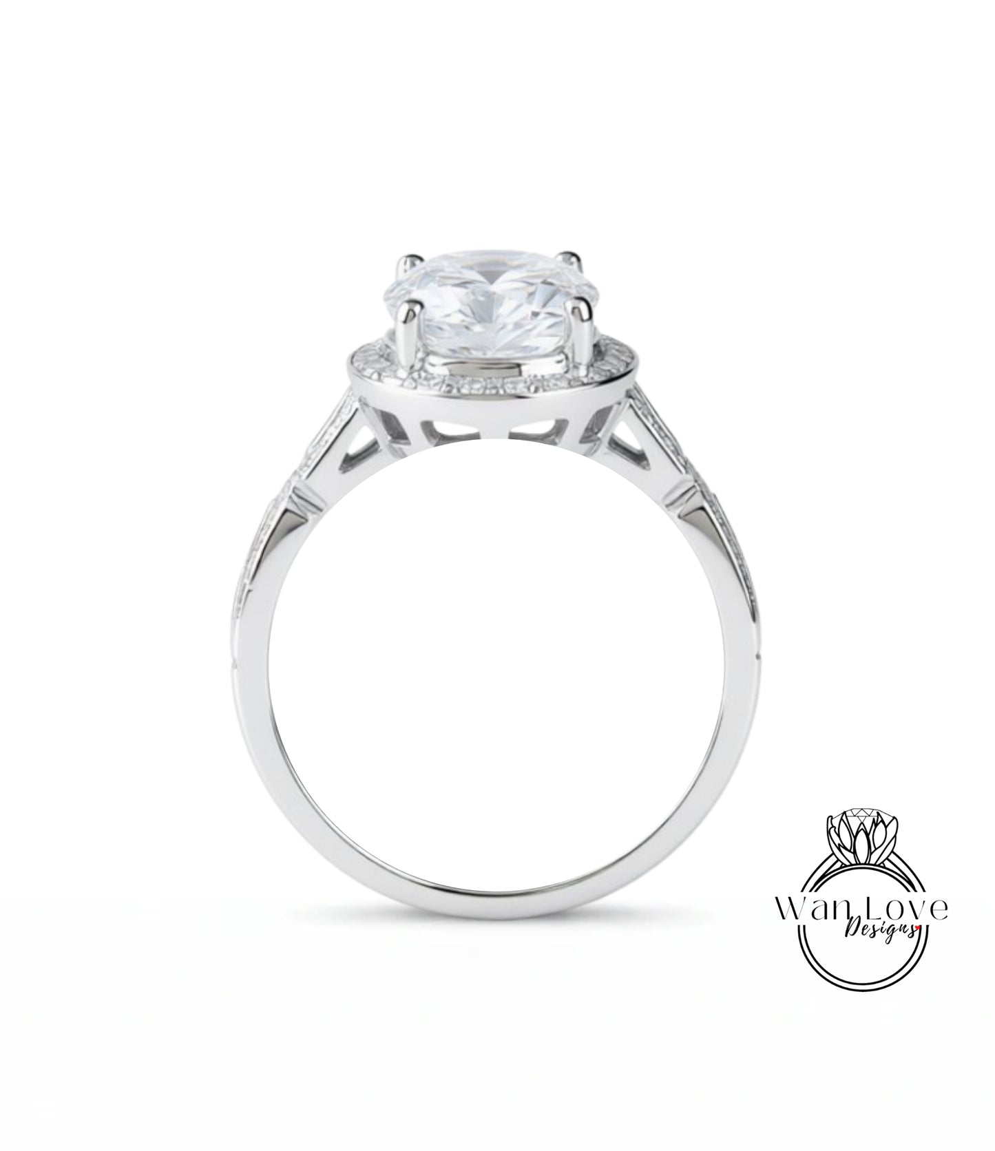 A silver engagement ring with a large central diamond surrounded by smaller diamonds.
