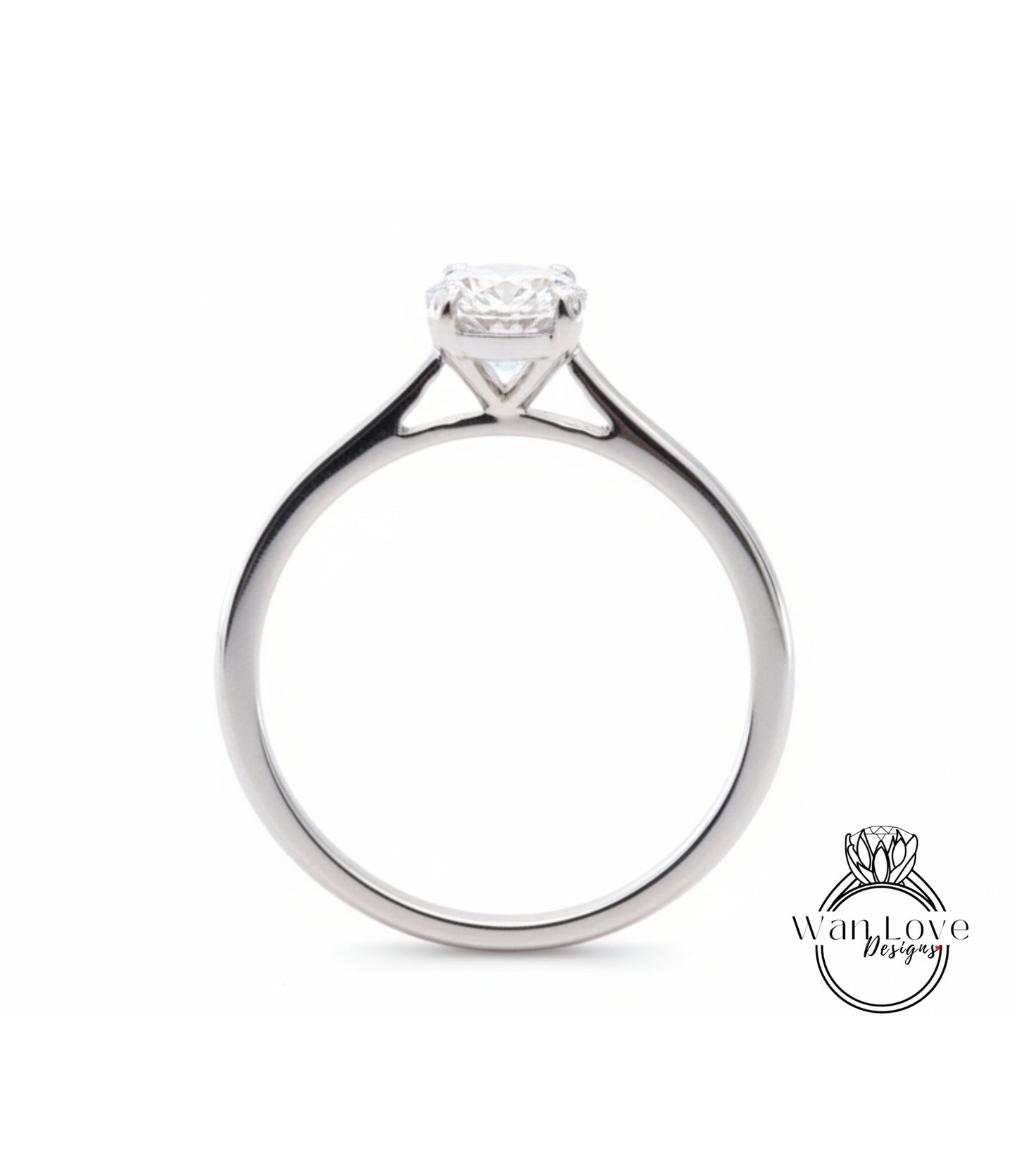 A silver engagement ring with a large diamond set in the center of the band.