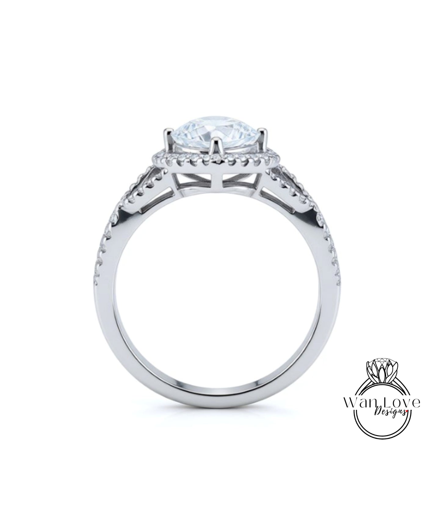 A silver engagement ring with a large central diamond surrounded by smaller diamonds on either side.