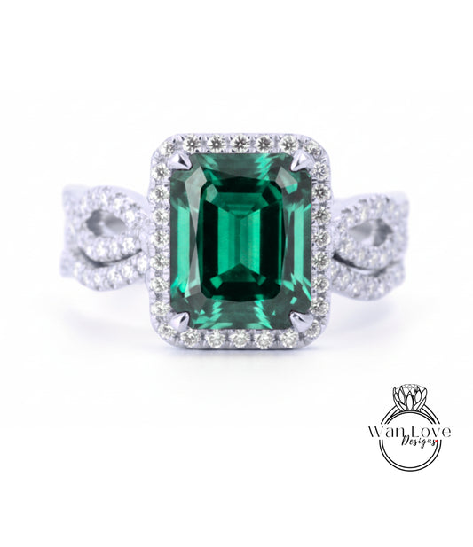 A stunning ring featuring a large, vibrant green gemstone surrounded by a halo of sparkling diamonds.