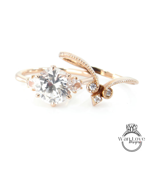 A close-up image of a gold ring with a large, clear gemstone set in the center, surrounded by smaller diamonds.
