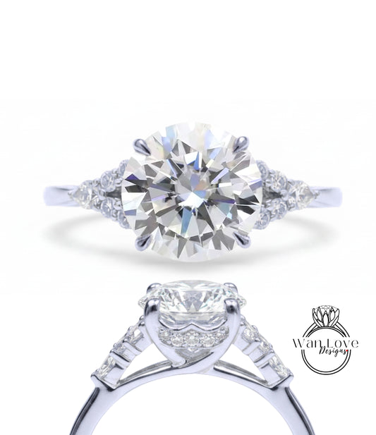 A close-up view of a diamond engagement ring with a large round brilliant cut diamond set in a silver band.